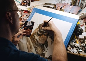 Photo of Alex Ross Drawing a Comic Book Cover