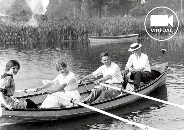 Antique photo of 4 people rowing an old canoe