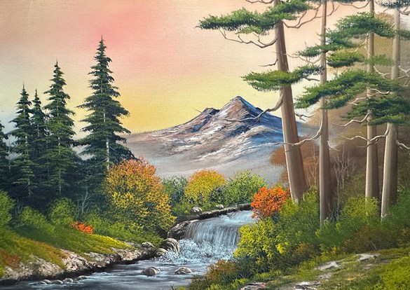 Photo of Boss Ross painting. River moving through tree lined shore with mountains in the background.