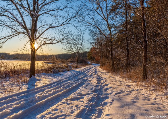 Beautiful sunset over snow covered trails.