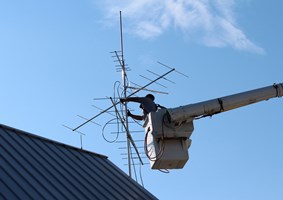 The new Motus Wildlife Tracking System being installed on a roof top