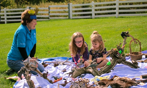 Volunteer helping with a young children's program