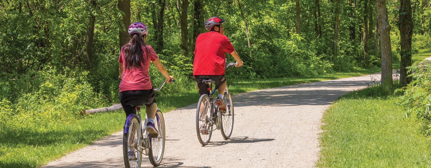 A couple riding their bikes on the trail