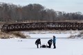 Three men at Independence Grove ice fishing