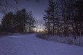 Photo of the snow covered solar-lit trails at night