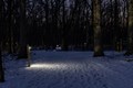 Photo of the snow covered solar-lit trails at night time