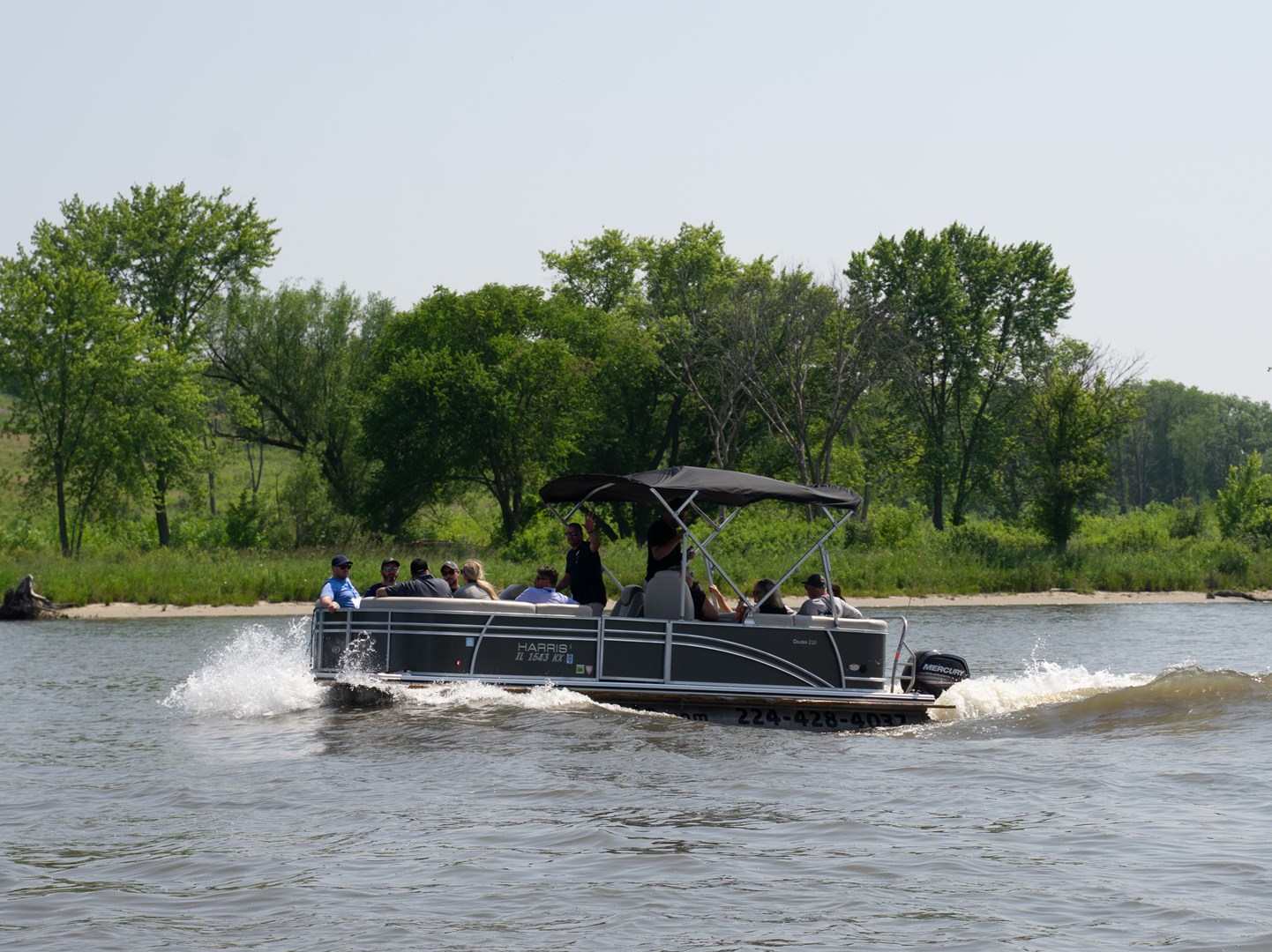 Group of people enjoying a pontoon ride on the Fox River